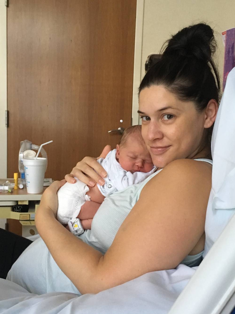Amanda in the hospital with newborn Betty. 