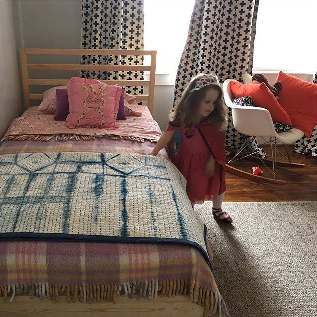 Mandy's daughter Etta with her (finished!) quilt (2019).